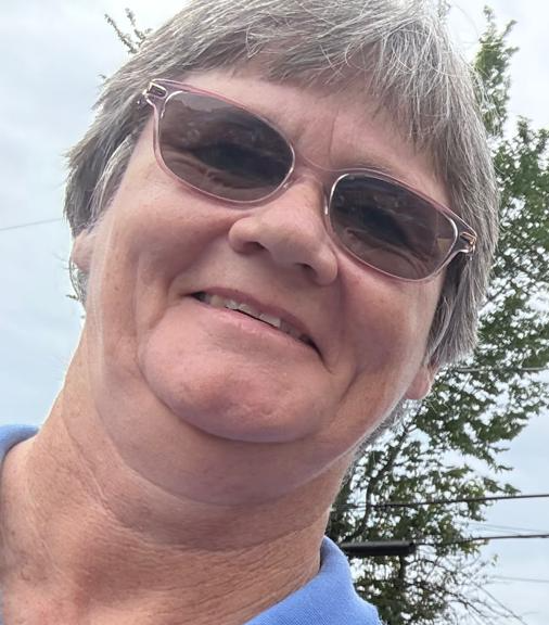 Sister Joan Pikiell stops to snap a selfie at the race