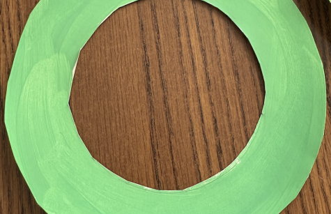 photo of green paper cut out for creating a wreath