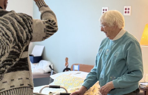 Father Gaddy blesses Sister Mary Frances Angermaier's room Father Gaddy blesses Sister Mary Frances Angermaier's room