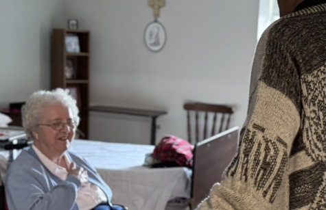 Father Gaddy blesses Sister Virginia Brien's room Father Gaddy blesses Sister Virginia Brien's room