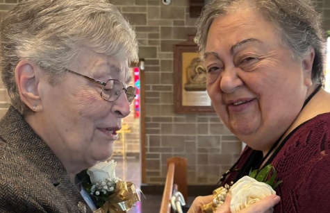 Sister Marie de Sales O'Dowd helps Sue Czaplicki with her corsage