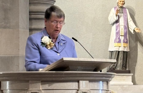 Sister Maureen Ulatowski reads at Mass
