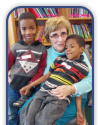 Sister Evelyn with two students from the Notre Dame Learning Center